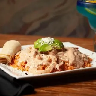 Pollo Con Crema covered in a light cream sauce